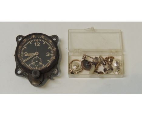 A small circular dashboard timepiece/stop watch, having revolving outer dial, subsidiary dial & centre sweep seconds hand ope