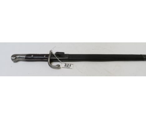 A bayonet with wood grip, long straight single edge blade and in leather covered scabbard, blade 38cm