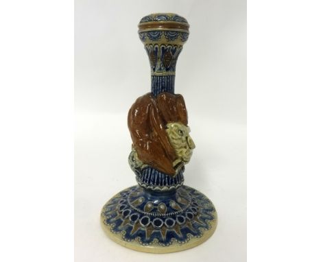 	A Martin Brothers pottery candlestick with hound and rabbits, damaged, incised mark, R.W.Martin, London 1876 (No 64), 20cm.