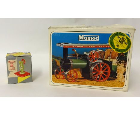 A Mamod steam tractor with power press, boxed.