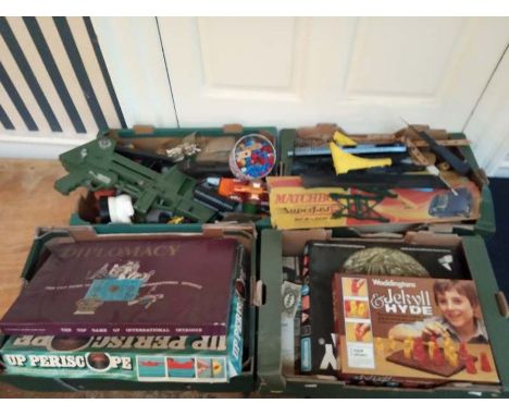 A scratch built wooden toy garage, plus 4 boxes of assorted vintage die cast cars, models and board games.