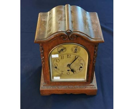An early 20th century oak cased bracket clock with chime switch. 39cm high, 26cm wide, 18cm deep.
