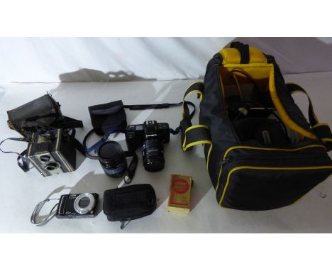 &nbsp;A camera bag full of camera and lenses, to include a Coronet roll film colour filter camera, Minolta, a Lumix 10X and a