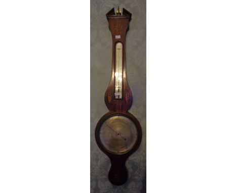 A 19th century wheel barometer. Mahogany case with inlaid conch shells and flowerhead motifs. 8-inch silvered dial signed 'Ve