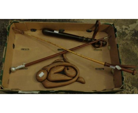 A 20th Century hardwood police truncheon with leather wrist strap plus a leather bound swagger stick, a leather bound riding 