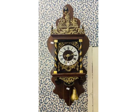 A large Dutch style reproduction&nbsp; barge wall clock with two train driven movement, 6" dial, striking on a bell. Cast Atl