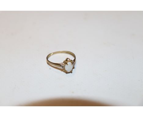 A 9ct gold opal and diamond set ring, the four claw set opal with diamonds either side, ring size N, approx. 1.3gms 