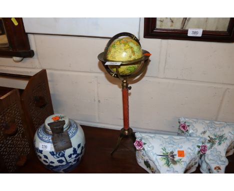 A globe on tripod base