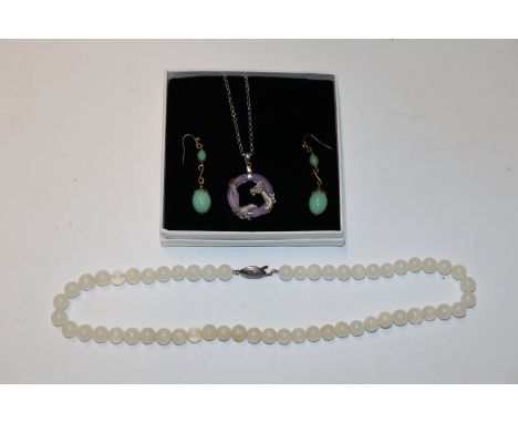 A 925 silver polished stone pendant decorated with a dragon hung to fine link chain; a bead necklace and a pair of jade colou