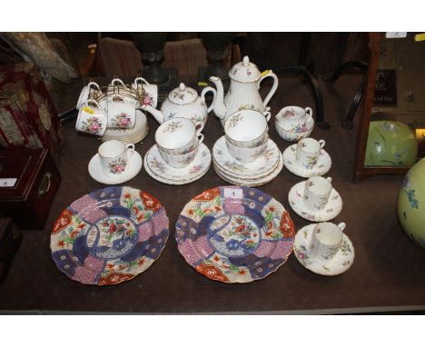 A pair of Royal Worcester 'Imari' pattern cabinet plates; and quantity of Royal Worcester "Roan Oke" teaware