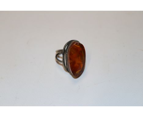 A large vintage silver and amber ring size N/O