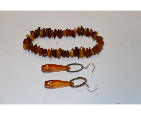 A pair of vintage amber drop ear-rings and a natural amber bracelet 
