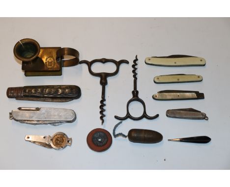 A box containing pen knives, cork screws, chamber stick etc.