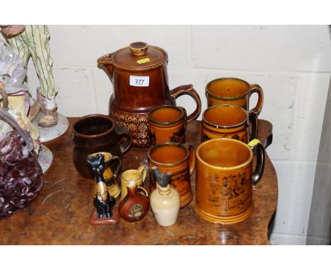 An Arthur Wood tea pot and various tankards 