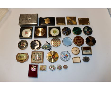 A silver and enamel decorated compact AF; and a large quantity of various other compacts, pill boxes and cigarette lighters 