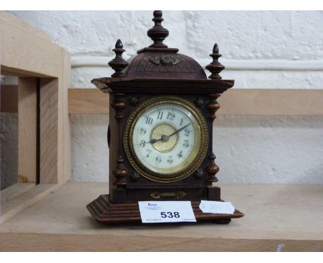Small continental mantel clock in architectural case