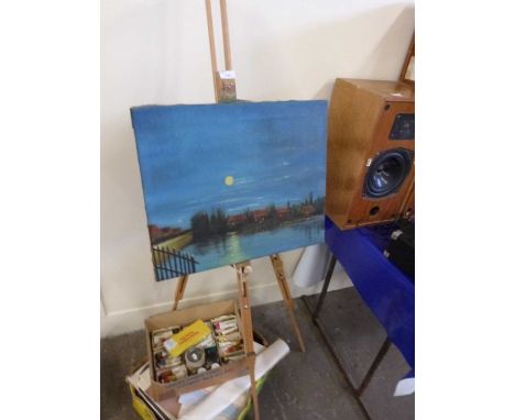 Artists easel together with a quantity of various artists supplies