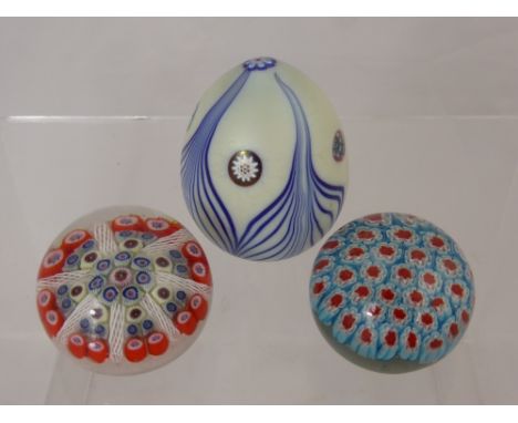 Two Millefiori Paperweights, the first with dense red and blue cluster of canes, the second with white twisted canes together
