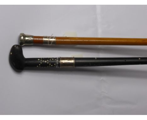 An Ebony Sri Lanka Walking Stick, banded in three sections with silver metal collar together with a walking stick with a blue