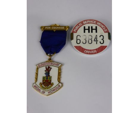 A Silver and Enamel Gloucestershire Medal of Honour and Courage, awarded to Charles Irwing by MP Michael Jenkins together wit