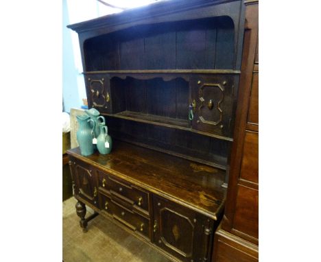A Vintage Tudor Style Cottage Dresser, having two shelves with cupboards to top and two drawers and cupboards below, with bra