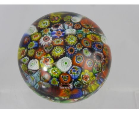 A Vintage Millefiori Paperweight, with multi-coloured canes, approx 8 cms, indistinct signature to base.