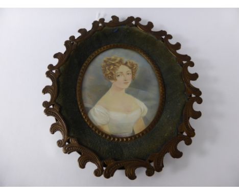An Antique Portrait Miniature, painted on copper, signed Dorian, presented in a decorative copper frame.
