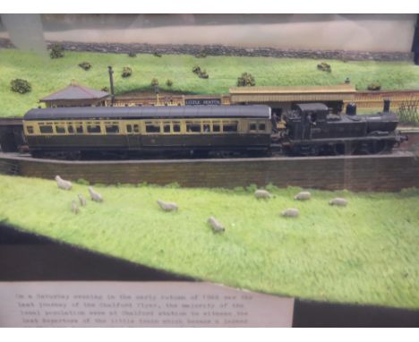 A Diorama Scale Model of the 'Chalford Flyer', contained within a glass case, together with two black and white photographs o