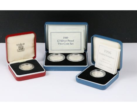 A collection of three Royal Mint silver proof coin sets to include the 1989 £2 coin two coin set, 1983 £1 coin and the 1996 £