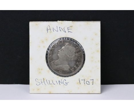 A British early milled Queen Anne 1707 silver shilling coin. 