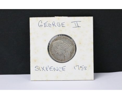 A British early milled King George II 1758 silver sixpence coin. 