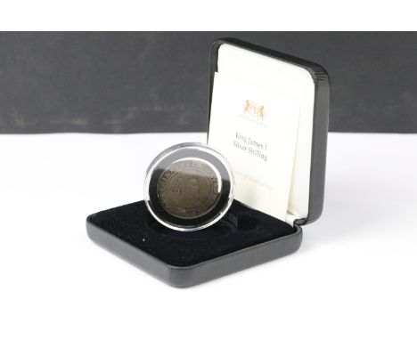 A British hammered silver King James 1st (1604-1625) shilling coin, encapsulated within fitted display case and with COA.