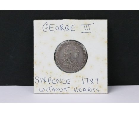 A British early milled King George III 1787 silver sixpence coin. 