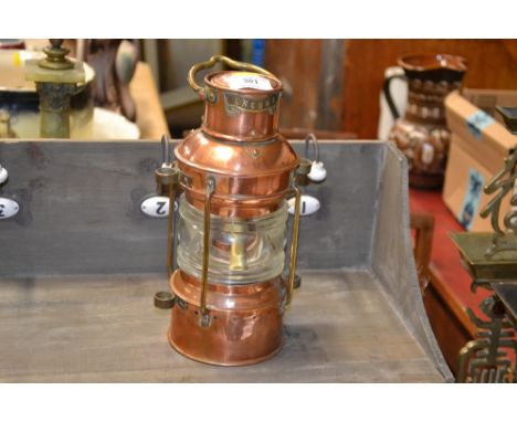 A copper and brass anchor lamp