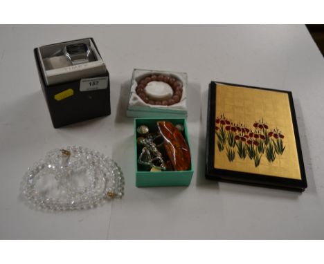 A Timex digital wrist watch; a quantity of various thimbles; two bead necklaces; an amber coloured stone etc. 