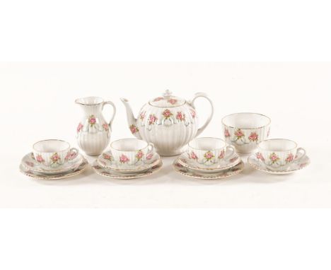 A Booths china part tea service, comprising 4 cups, saucers, 3 plates, teapot, sugar basin and jug.