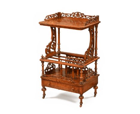 A Victorian walnut Canterbury whatnot of two tier form, the rectangular moulded upper shelf on carved and turned supports abo