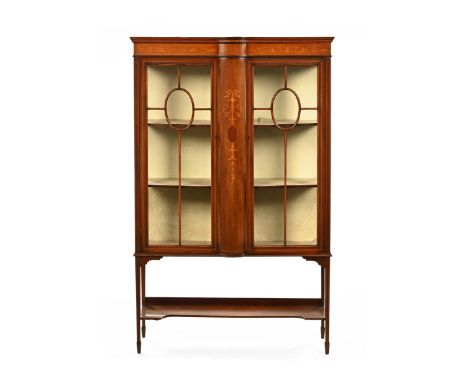 An Edwardian inlaid mahogany display case, with glazed doors with wooden astragals enclosing shelves and raised on tapered le