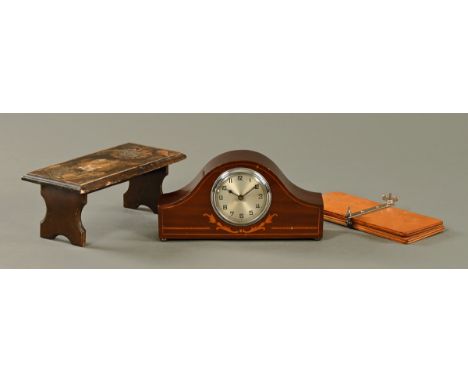 An Edwardian inlaid mahogany eight day mantle clock, together with a miniature folding poker work table and a tie press.
