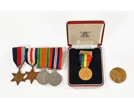 A World War II medal group to Philip Charles Carter MP (Director Traffic Sword Beach, Editor Rhine Army Magazine), together w