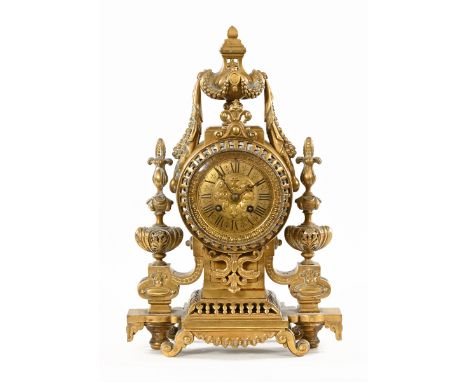 An early 20th century continental brass mantle clock, in the Neo-Classical style.  Height 40 cm. 