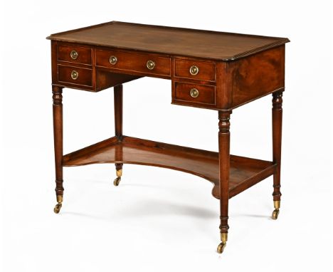 A George III mahogany dressing table, with shallow upstand moulded edge and five frieze drawers with brass drop handles, with