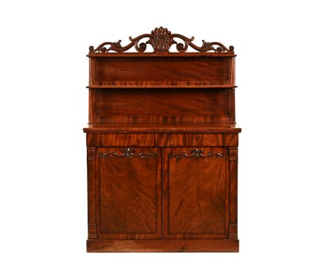 A Victorian mahogany chiffonier, the upper section with two shelves and carved cresting rail above a lower section with cupbo