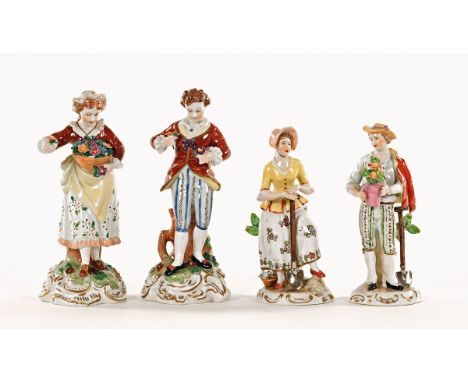 A pair of early 20th century Dresden porcelain figures, flower lady and gentleman, and two Sitzendorf porcelain figures.