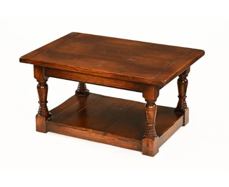 In the manner of Titchmarsh &amp; Goodwin an oak coffee table, rectangular with low shelf.  Height 46 cm, width 90 cm, depth 