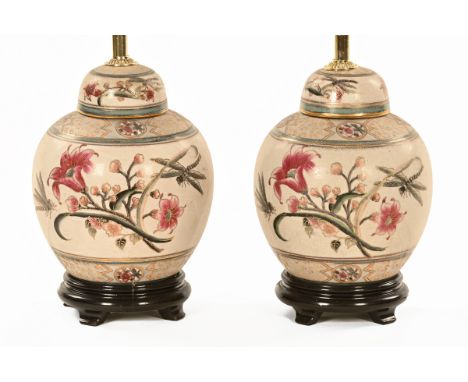 A pair of ginger jar form crackleware table lamps, each raised on a wooden base.  Height including light fitting 35 cm.