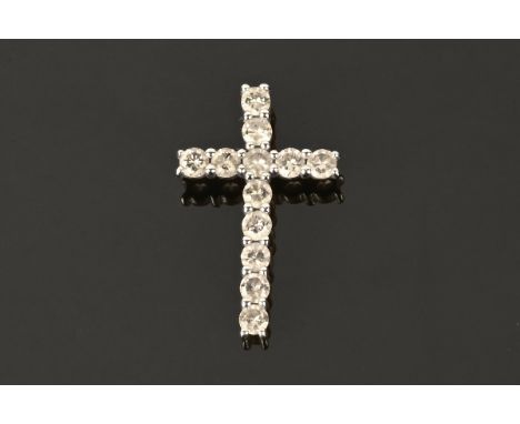 A 9 ct white gold cross pendant, stamped 9 k, set with +/- 1 carat of natural champagne cut diamonds.  25 mm x 15 m.  1.5 gra