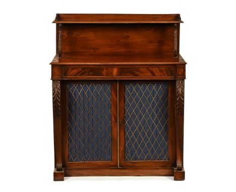 An early 19th century mahogany side cabinet, the upper tier with single shelf, with acanthus carved turned supports above a l