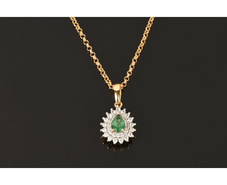 A 9 ct gold pear shaped emerald and diamond pendant, stamped 9 k TJC375 suspended on a 9 ct gold chain stamped 375, pendant e