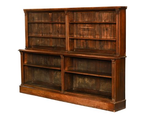 A William IV rosewood bookcase, in two sections the top half fitted with a series of adjustable shelves, the base with moulde